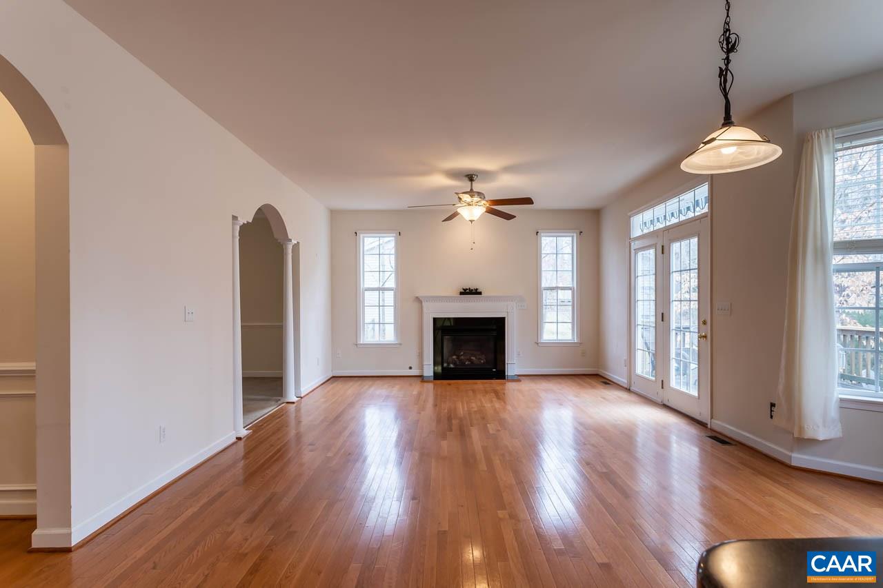 25 Haversack Road Palmyra, VA 22963 - Photo 8 of 42 a view of an empty room with wooden floor fireplace and a window