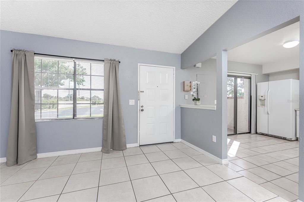 13100 South McCall Road, Unit 191 Port Charlotte, FL 33981 - Photo 13 of 44 a view of an empty room with window and cabinet