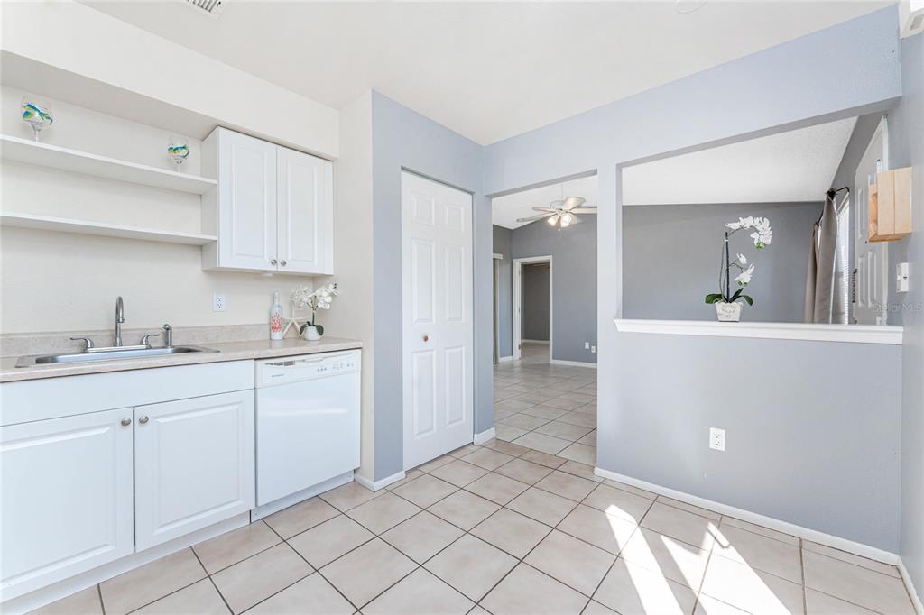 13100 South McCall Road, Unit 191 Port Charlotte, FL 33981 - Photo 17 of 44 a spacious bathroom with a sink mirror and cabinets