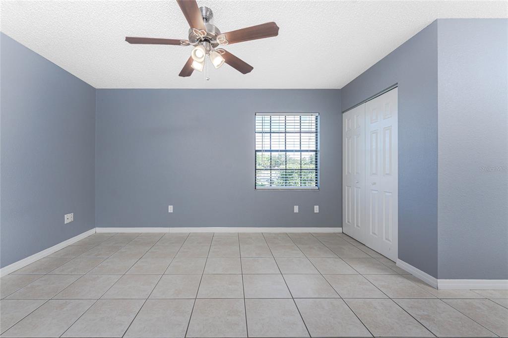 13100 South McCall Road, Unit 191 Port Charlotte, FL 33981 - Photo 18 of 44 wooden floor in an empty room with a window