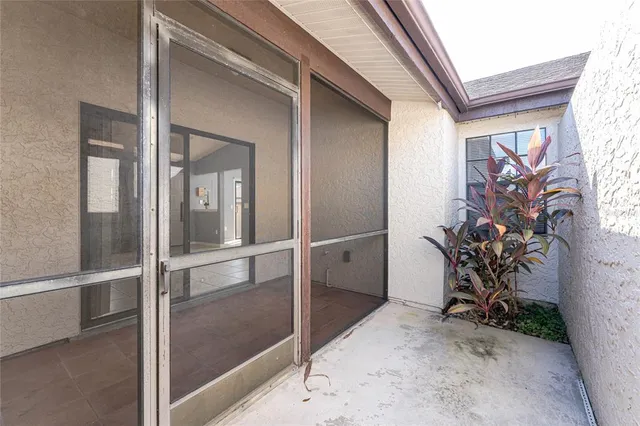 a view of a hallway with paintings on the wall