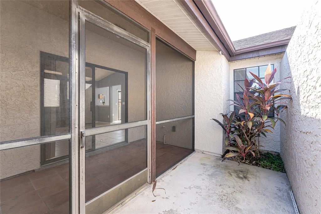 13100 South McCall Road, Unit 191 Port Charlotte, FL 33981 - Photo 32 of 44 a view of a hallway with paintings on the wall