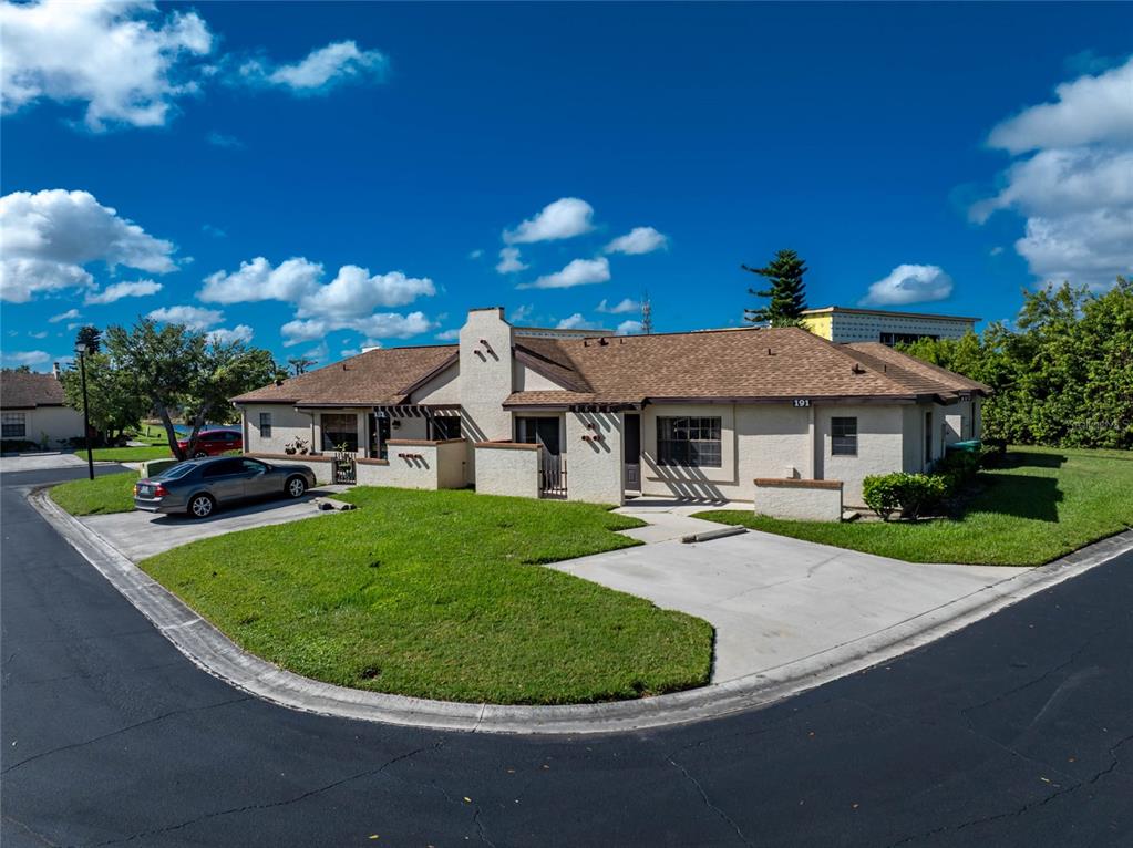 13100 South McCall Road, Unit 191 Port Charlotte, FL 33981 - Photo 34 of 44 a view of a house with a backyard porch and sitting area