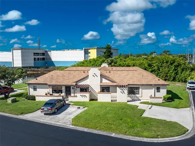 a view of house with outdoor space and swimming pool