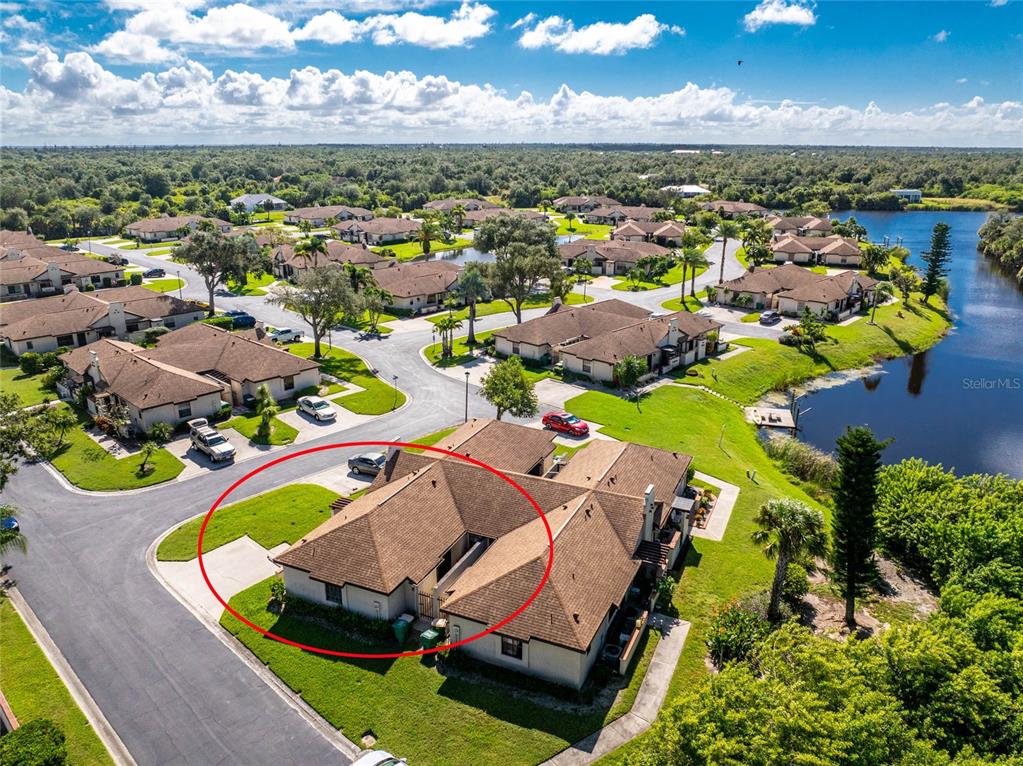 13100 South McCall Road, Unit 191 Port Charlotte, FL 33981 - Photo 37 of 44 an aerial view of residential houses with outdoor space