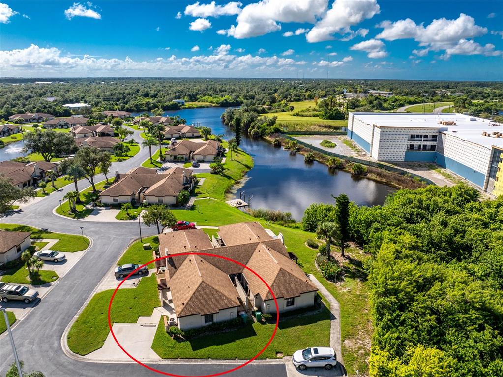 13100 South McCall Road, Unit 191 Port Charlotte, FL 33981 - Photo 38 of 44 an aerial view of a house with a swimming pool yard and outdoor seating