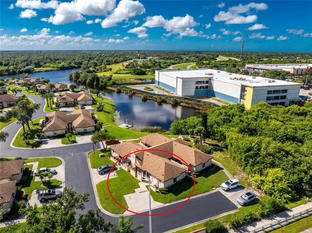 an aerial view of residential houses with outdoor space