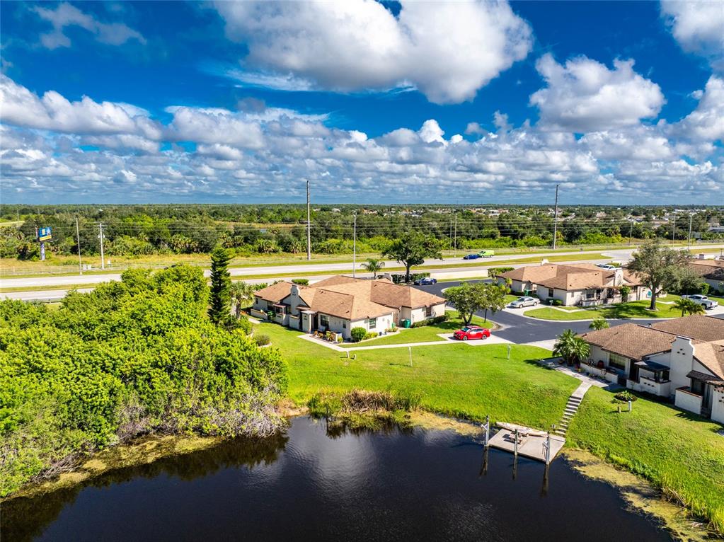 13100 South McCall Road, Unit 191 Port Charlotte, FL 33981 - Photo 43 of 44 a view of a lake with a city