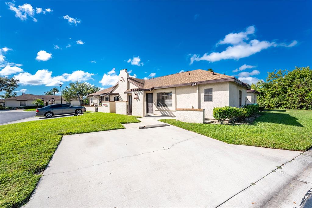 13100 South McCall Road, Unit 191 Port Charlotte, FL 33981 - Photo 6 of 44 a view of a house with a yard