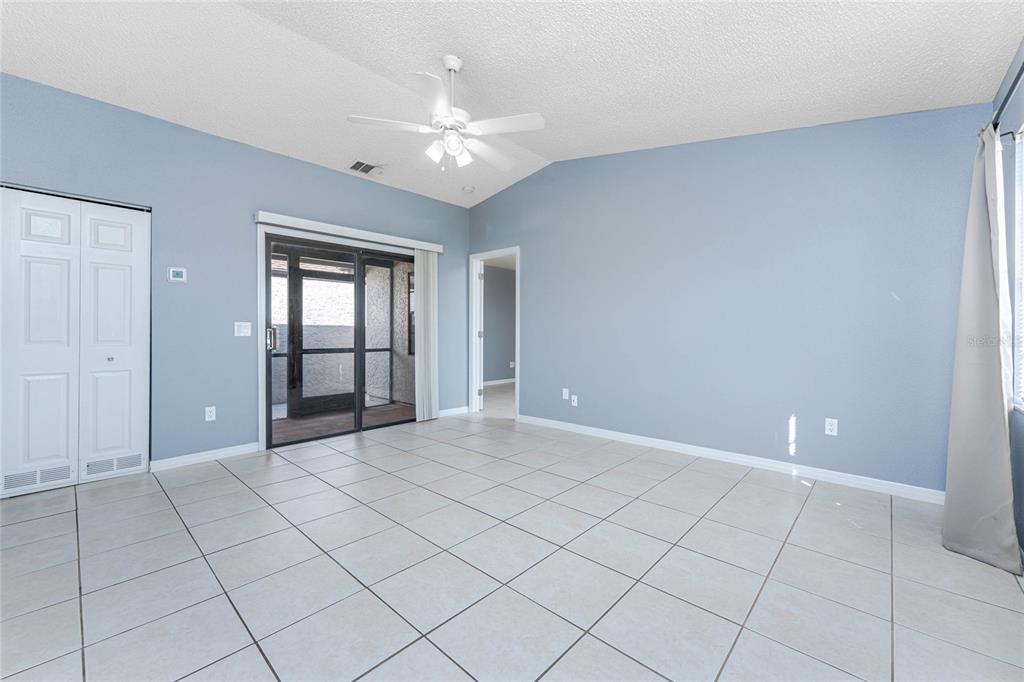 13100 South McCall Road, Unit 191 Port Charlotte, FL 33981 - Photo 9 of 44 a view of an empty room with a chandelier