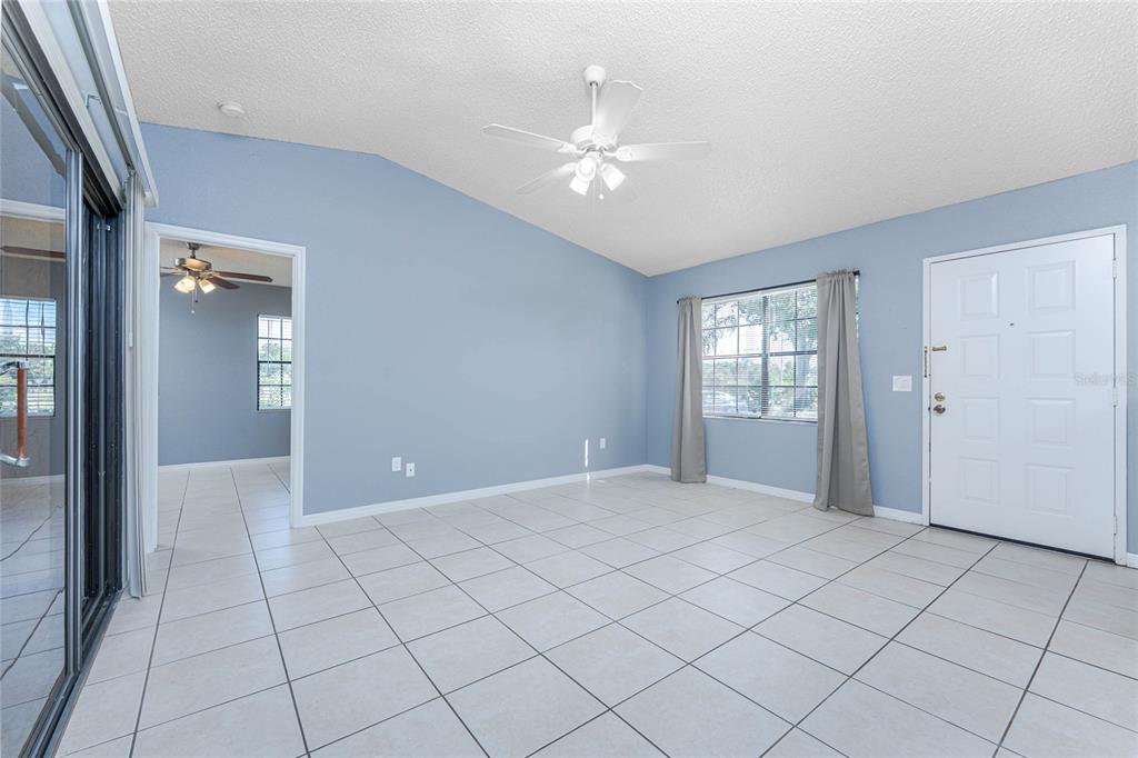 13100 South McCall Road, Unit 191 Port Charlotte, FL 33981 - Photo 10 of 44 a view of an empty room with window and wooden floor
