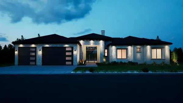 a front view of a house with a garden