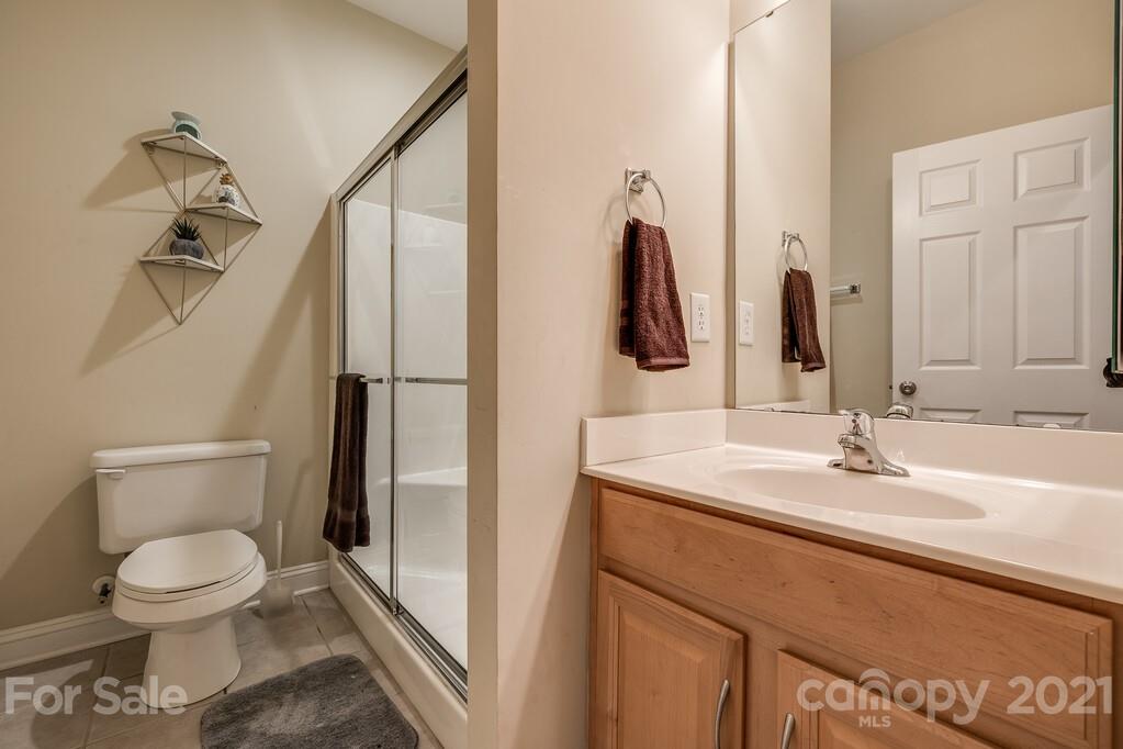 415 Fischer Road Fort Mill, SC 29715 - Photo 16 of 48 a bathroom with a toilet sink and mirror