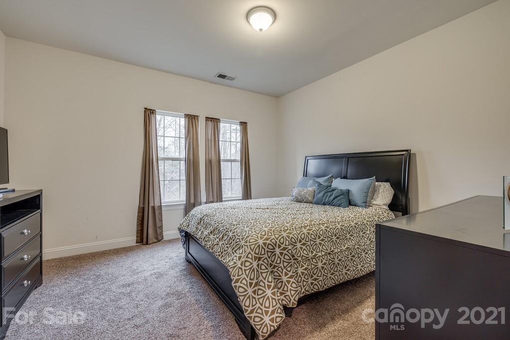 415 Fischer Road Fort Mill, SC 29715 - Photo 17 of 48 a bedroom with a bed and window