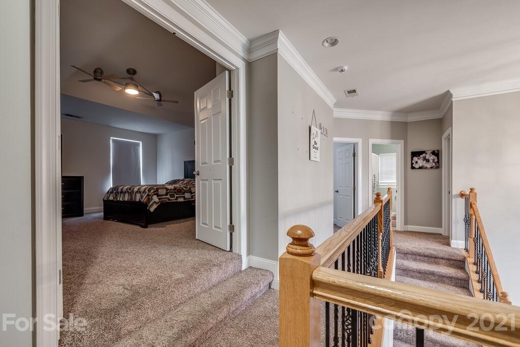 415 Fischer Road Fort Mill, SC 29715 - Photo 19 of 48 a view of a livingroom with furniture and staircase