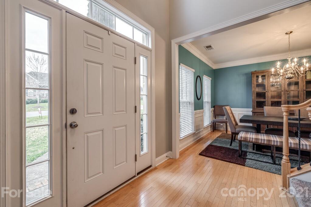 415 Fischer Road Fort Mill, SC 29715 - Photo 3 of 48 a dining room with furniture and wooden floor