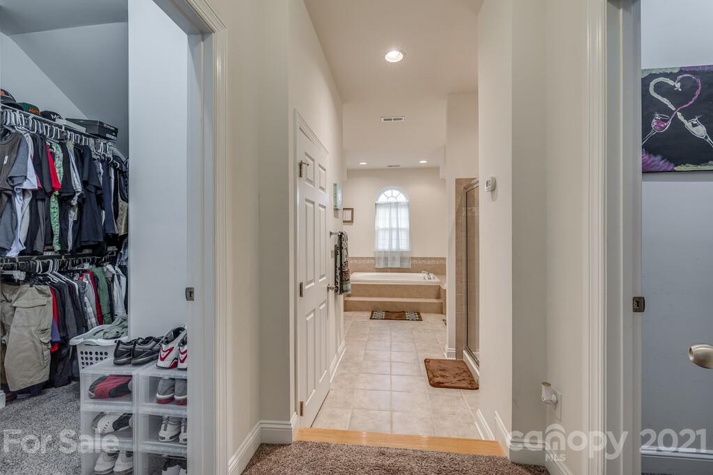 415 Fischer Road Fort Mill, SC 29715 - Photo 23 of 48 a view of walk in closet with clothes and shoes