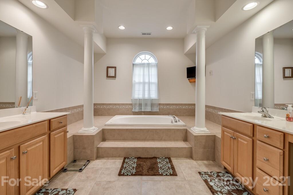 415 Fischer Road Fort Mill, SC 29715 - Photo 24 of 48 a spacious bathroom with a tub sink and mirror