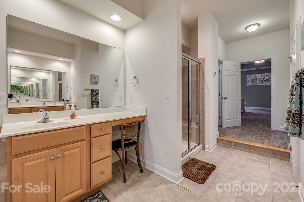 415 Fischer Road Fort Mill, SC 29715 - Photo 26 of 48 a spacious bathroom with a sink a toilet a mirror and a shower
