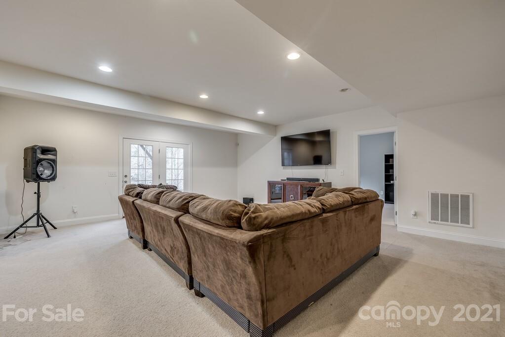 415 Fischer Road Fort Mill, SC 29715 - Photo 38 of 48 a living room with furniture and a flat screen tv