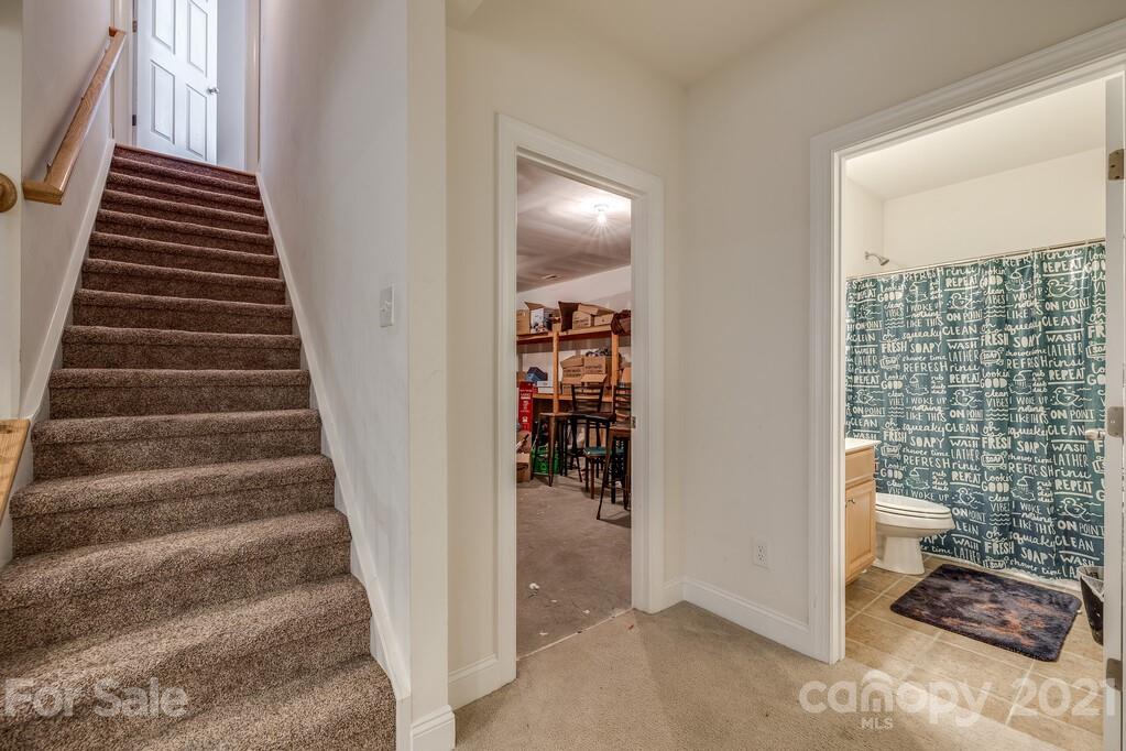 415 Fischer Road Fort Mill, SC 29715 - Photo 40 of 48 a view of a hallway with wooden floor and windows