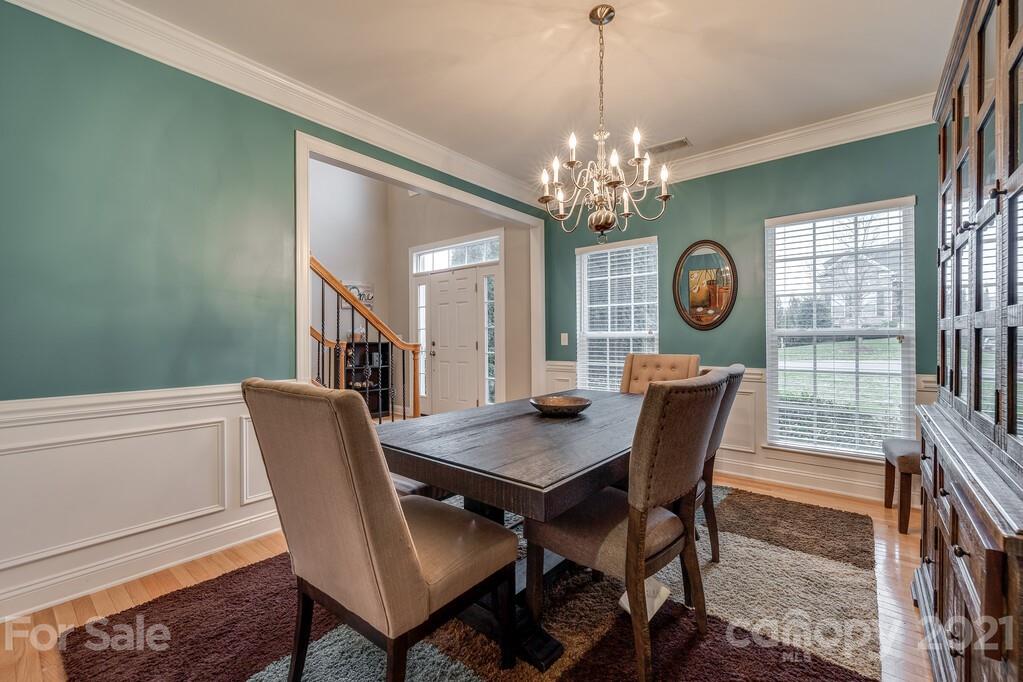 415 Fischer Road Fort Mill, SC 29715 - Photo 7 of 48 a view of a dining room with furniture window and wooden floor