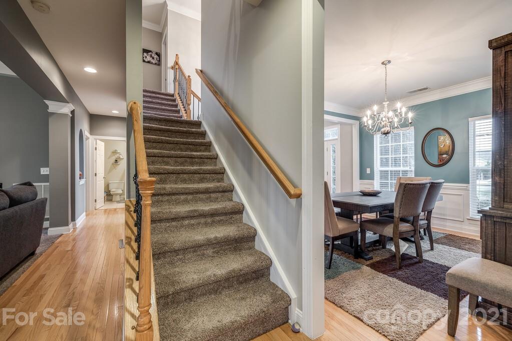 415 Fischer Road Fort Mill, SC 29715 - Photo 8 of 48 a view of a hallway with furniture and chandelier