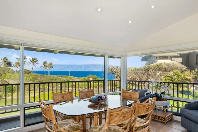 a dining room with furniture mountain view and a potted plant
