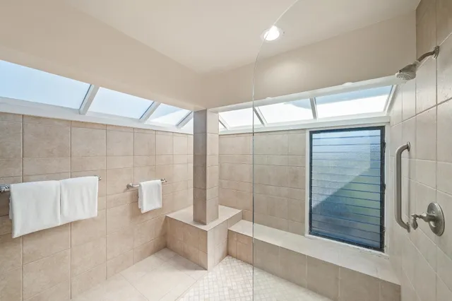 a bathroom with a bathtub and shower