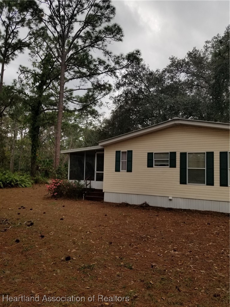 9125 Spur Path Sebring, FL 33875 - Photo 30 of 31 Back porch second door