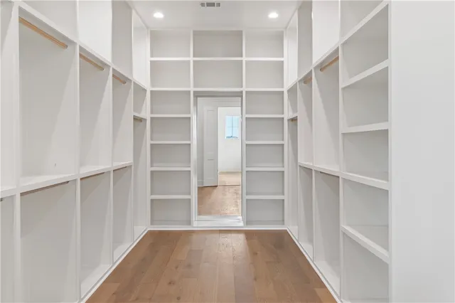 a view of an empty walk in closet