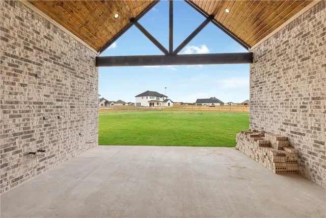 a view of a house with a yard and garage
