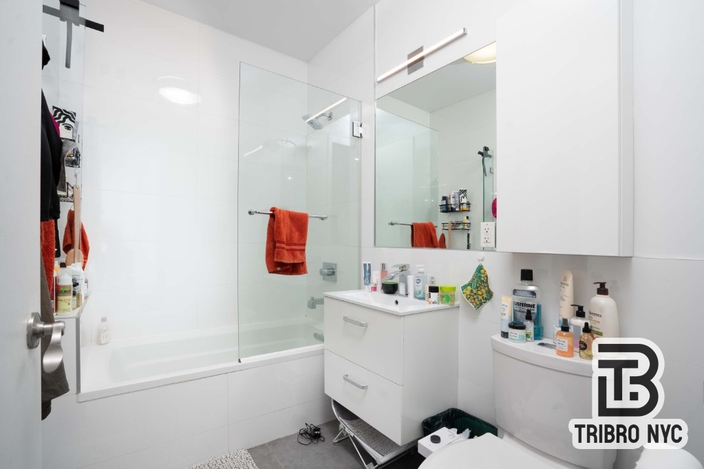 230 East 124th Street, Unit 4B Manhattan, NY 10035 - Photo 8 of 8 a room with storage and utility