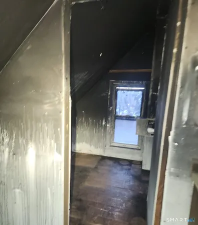 a view of a room with a wooden floor