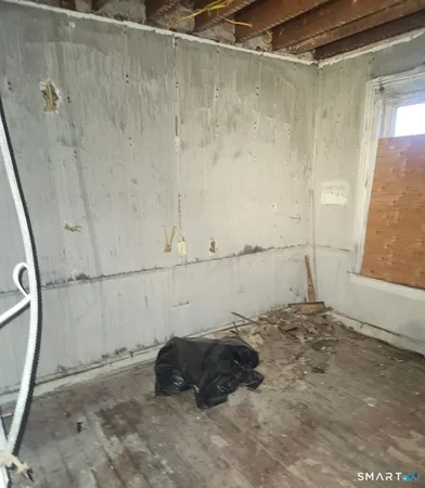 a view of room with window and furniture