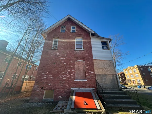 a front view of a house with roof