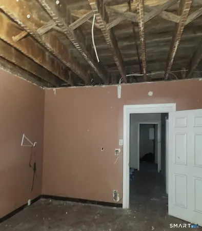 a view of room with a ceiling fan and window