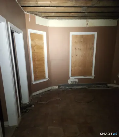 a view of an empty room with a window