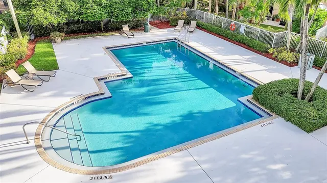 a view of a balcony with floor to ceiling windows with wooden floor