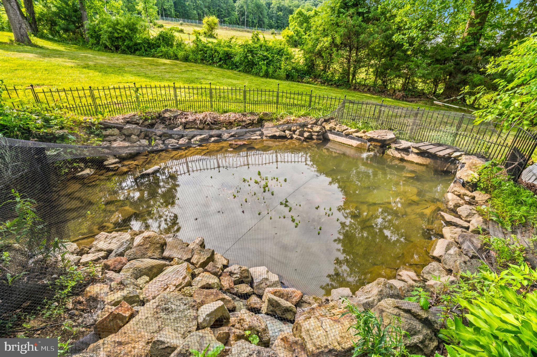278 Harbaugh Valley Road Fairfield, PA 17320 - Photo 45 of 51 Serene garden pond with stone border.