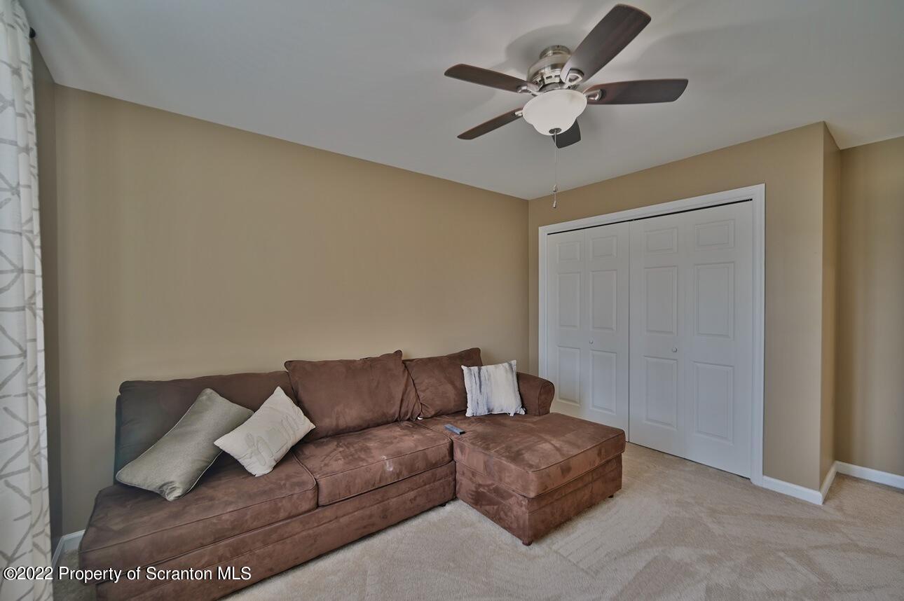 327 Golf Club Road Lake Ariel, PA 18436 - Photo 54 of 79 a living room with furniture and a ceiling fan
