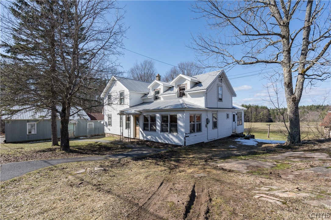 7923 Soft Maple Road New Bremen, NY 13327 - Photo 1 of 1 Exterior of house showing 2 stall garage