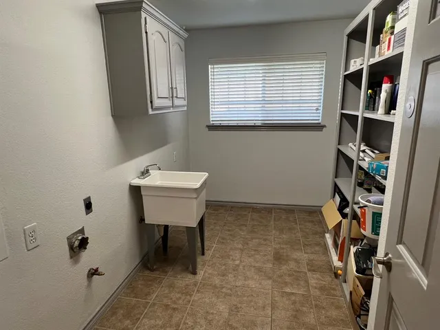 a bathroom with a sink a toilet and a shower