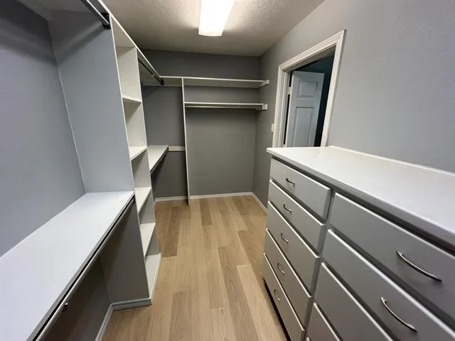 a storage room with wooden floor