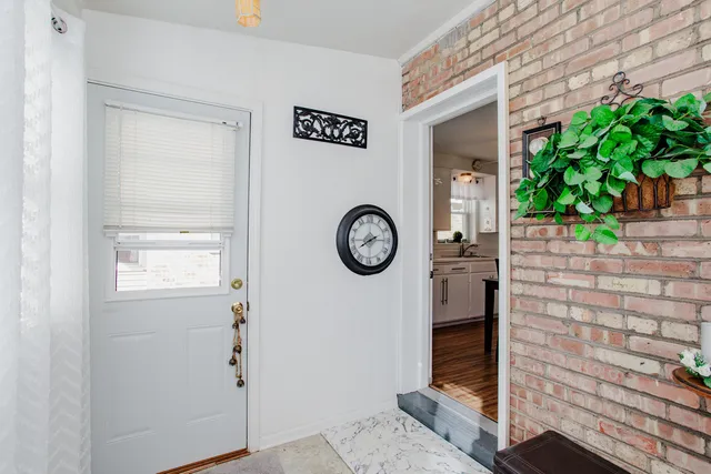 a view of entryway with wooden floor