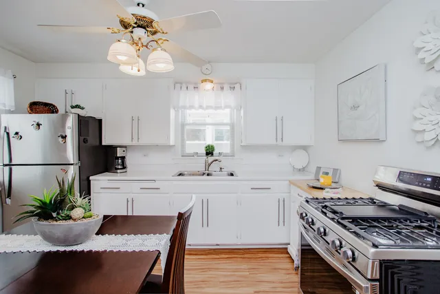 a kitchen with a table and chairs in it