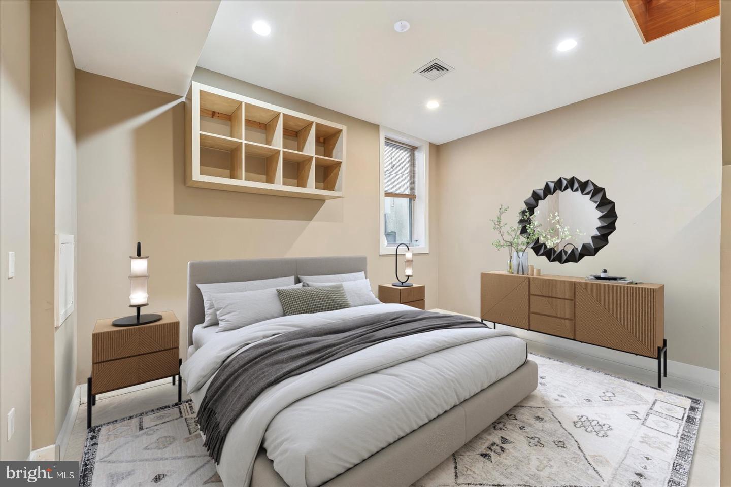 635 North 13th Street, Unit A Philadelphia, PA 19123 - Photo 16 of 17 a bedroom with a large bed and a chandelier