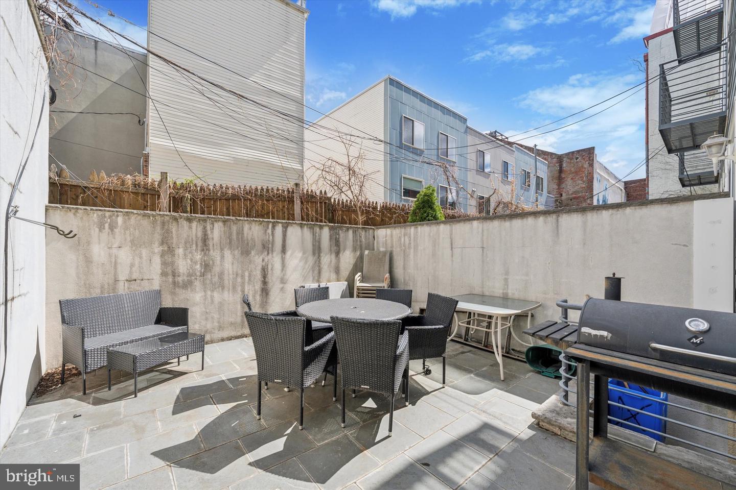 635 North 13th Street, Unit A Philadelphia, PA 19123 - Photo 17 of 17 a patio with table and chairs