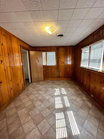 a view of entryway with a window and chandelier