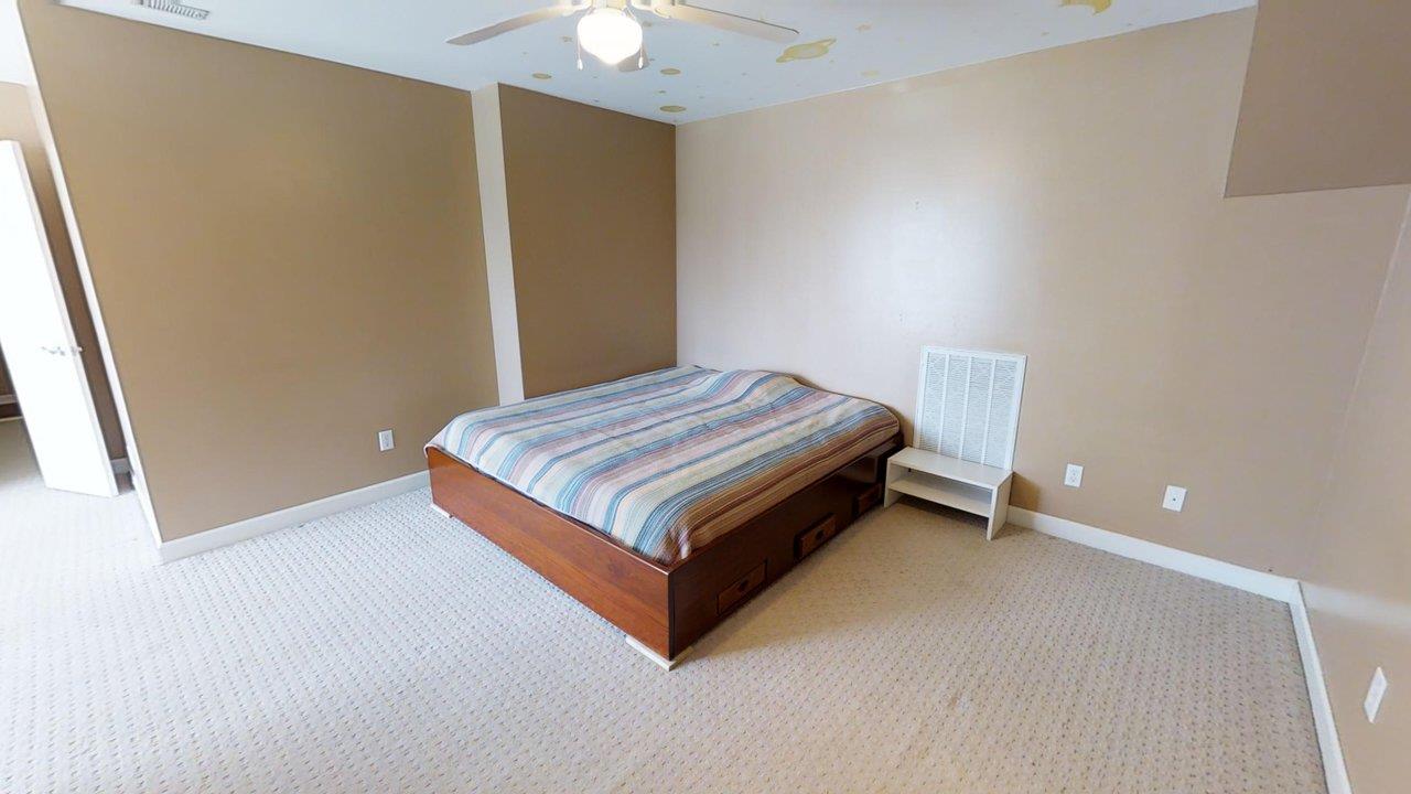 919 Sam Johnson Road Columbia, TN 38401 - Photo 21 of 29 a bed sitting in a room next to a window